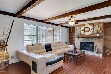 Family Room with Wood Beams On Ceiling