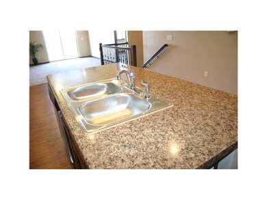Kitchen. Center island with sink, breakfast bar