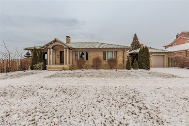View of front facade featuring a garage