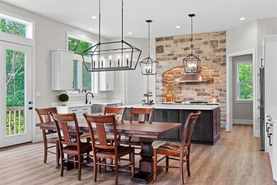 Tall windows make this kitchen a bright and cheerf