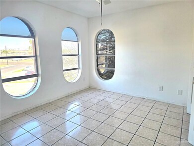 Bedroom with light tile patterned flooring