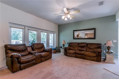 living room overlooking screened lanai and kitchen