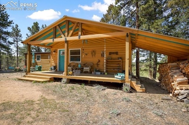 Log-style house with a wooden deck
