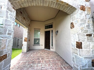 Closeup of front porch with brick pavers.