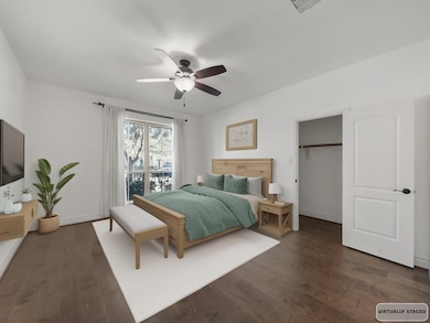 The downstairs secondary bedroom offers versatility and privacy, ideal for guests or multi-generational living — virtually staged for inspiration.
