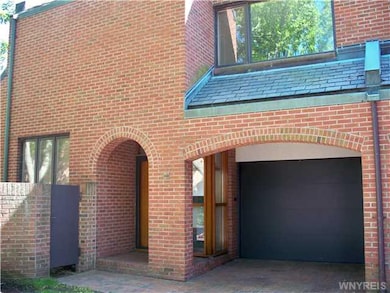 Exterior Front. Prime end unit!!  Covered front en
