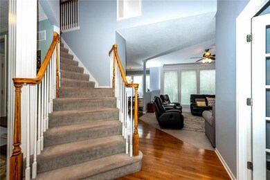 Large 2 story entry with stairs leading up to 4 be