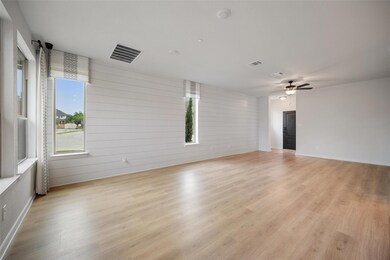 Empty room with light wood-style flooring, a ceil