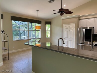 Kitchen with smart refrigerator, vaulted ceiling,