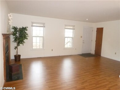 Living Room - Wood Laminate floors and a wood buri