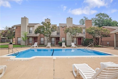 Community pool featuring a patio area