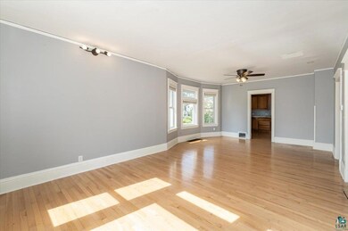 Spare room with light wood-type flooring, ceiling 