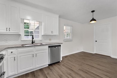 Kitchen with stainless steel appliances and eating
