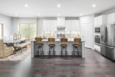 The island is included and has plenty of room for bars stools for guests!