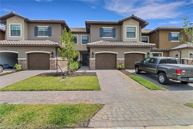 View of front of home featuring stone siding, a ti