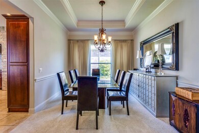Dining Room with Ornamental Molding, and a Tray Ce