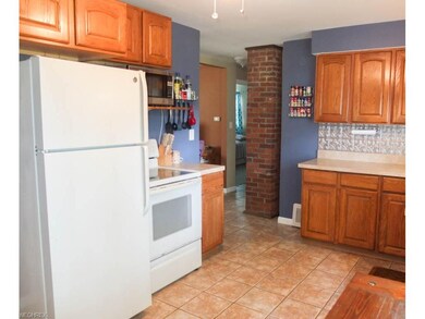 Kitchen comes applianced with a range, oven and re