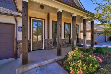 Property entrance with a garage and covered porch
