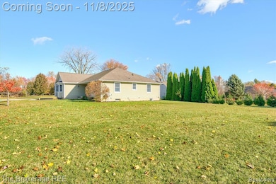 View of home's exterior with a yard