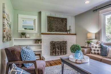 BEAUTIFUL BRICK WOOD BURNING FIREPLACE AND NOTICE THE CUSTOM BUILT IN'S 