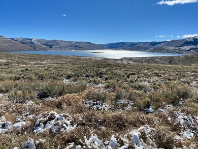 View of mountain backdrop featuring a large body of water