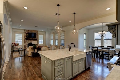 Kitchen with arched walkways, ornamental molding,