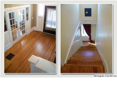 A view of the foyer and down the dramatic staircas