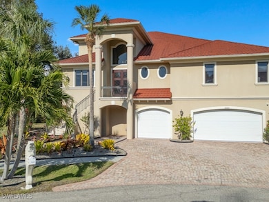 Mediterranean / spanish home featuring a garage