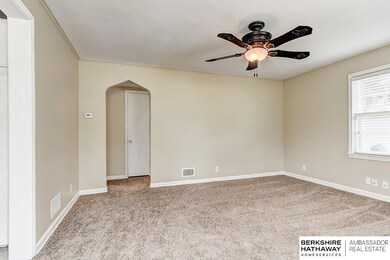 Cozy family room with freshly painted walls and brand new carpet.