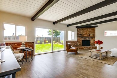 Spacious Open Living Room with Fireplace and Large