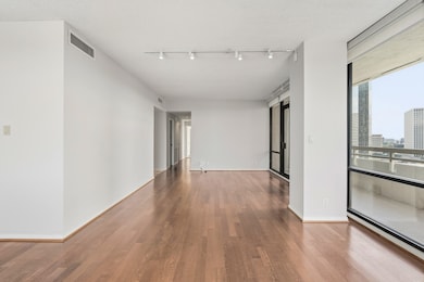 View of living room to hallway to beds/baths