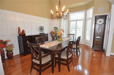 Gorgeous dining room with bay window will accommodate the whole family for a gathering.