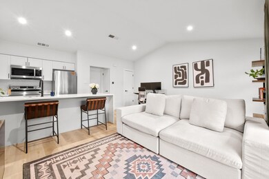Living area featuring light wood-style floors, lo