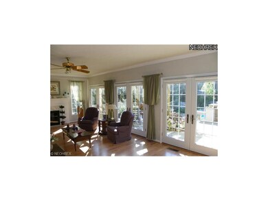 Great room wrapped with windows including 3 sets o