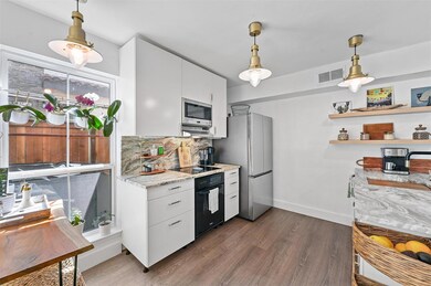 Kitchen featuring dark hardwood / wood-style floor