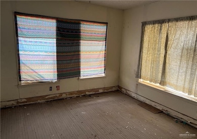 Unfurnished room with hardwood / wood-style floors