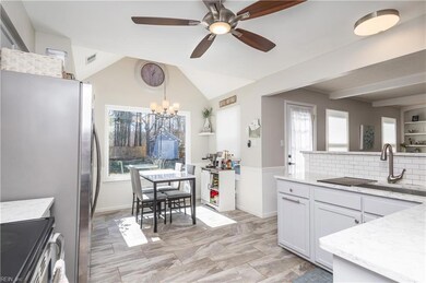 Modern and Updated Kitchen with Quartz Counters, b