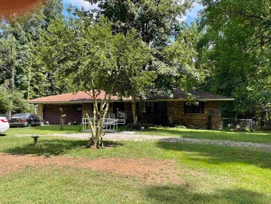 Ranch-style home with a front lawn
