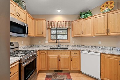Beautiful kitchen has ample cabinet and countertop space.