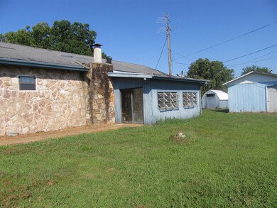 Back of the house has storage building 1 and 2