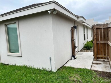 View of side of home with stucco siding