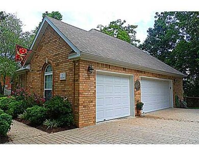 Exterior Front. drive up to your 3 car garage on patterned concret  driveway