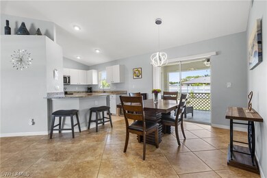 Dining area with vaulted ceiling, sink, an invitin