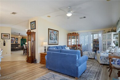Living area with light wood finished floors, visib