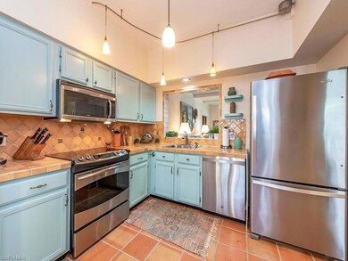 Kitchen with peek through to LR...Saltillo tile th