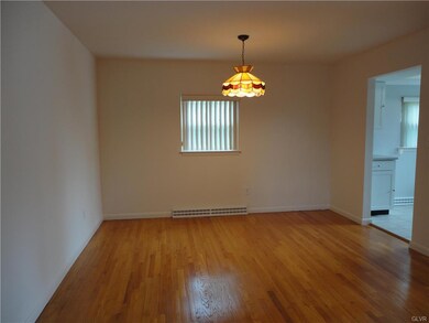 Spacious Dining Rm. w Tiffany Lighting.