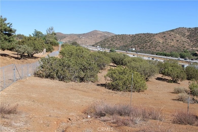 View of subject property - facing east along rear  fence line.