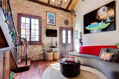 Exposed brick walls give the condo that New Orlean