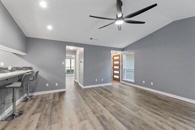 Unfurnished office featuring lofted ceiling, light
