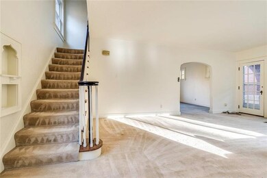 View of the living room as you enter through the f
